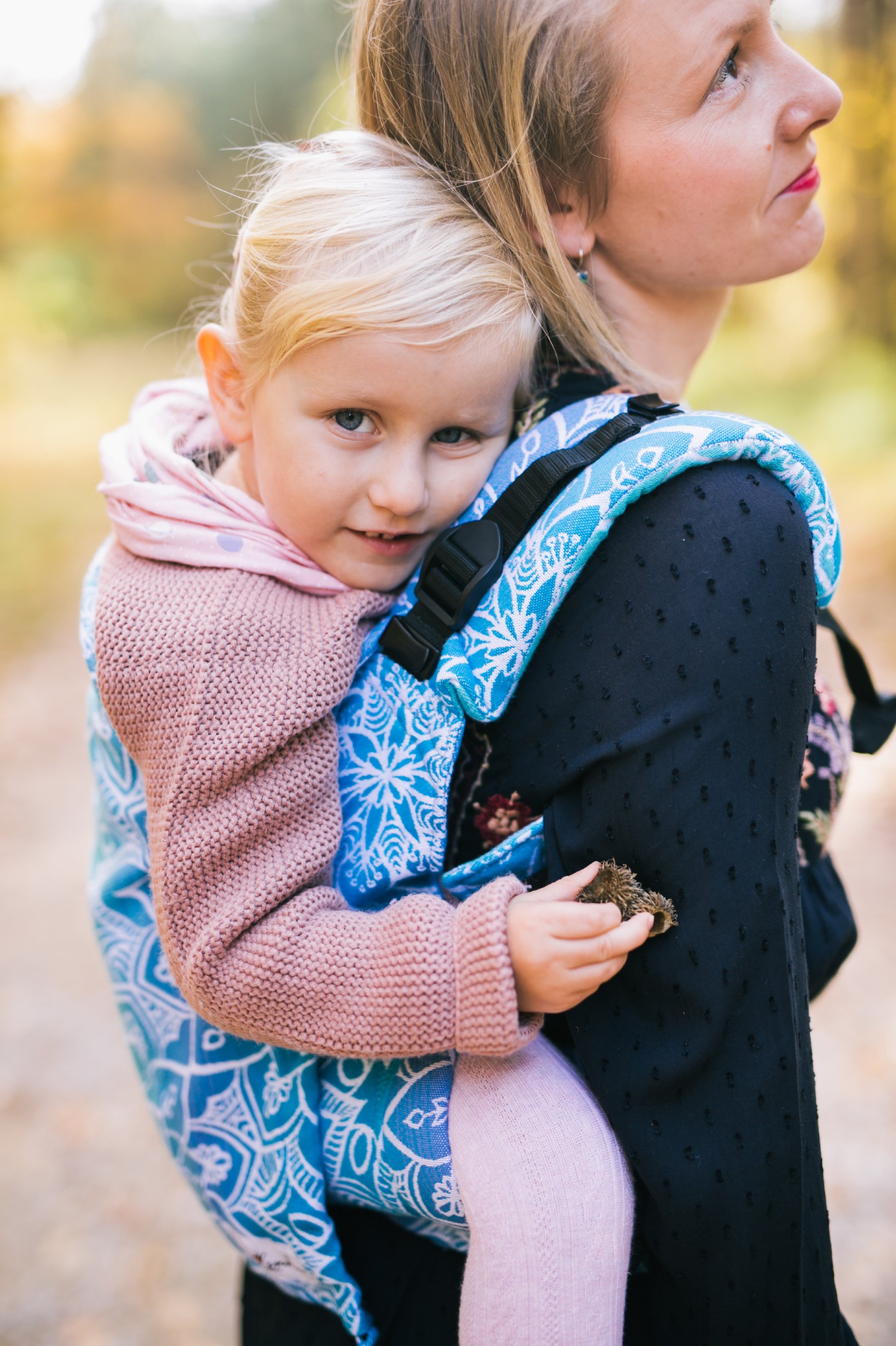 toddler in baby carrier